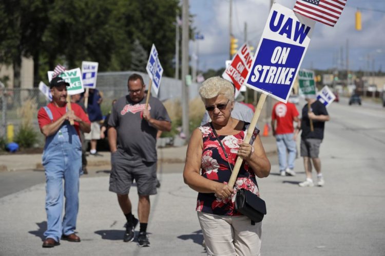 Mara Paulic, a 42-year GM employee, pickets outside the General Motors Fabrication Division in Parma, Ohio. 