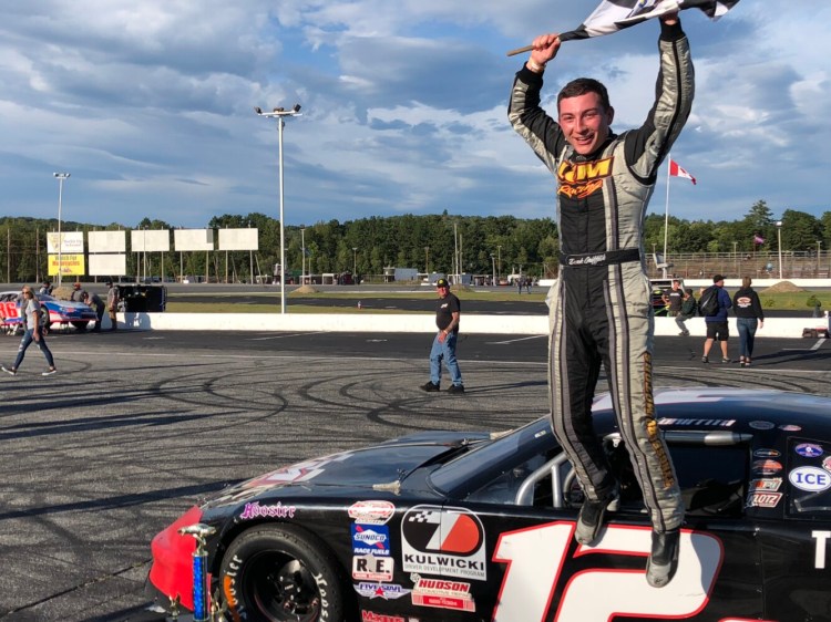 Derek Griffith of Hudson, N.H., celebrates his win in the Honey Badger Bar & Grill 150 at Oxford Plains Speedway in Oxford on Sunday. The win was the first PASS win at the track for Griffith.
