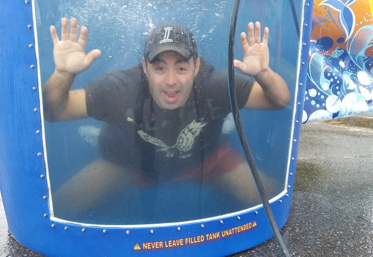 Carrabec Community School Principal Michael Tracy in the dunk tank during the school's Second annual Back to School Bash in North Anson.