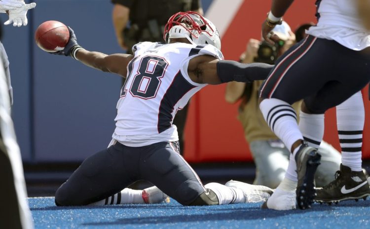 New England's Matthew Slater celebrates his touchdown after recovering a blocked punt against the Buffalo Bills on Sept. 29. According to reports, Slater signed a two-year extension with the Patriots. 