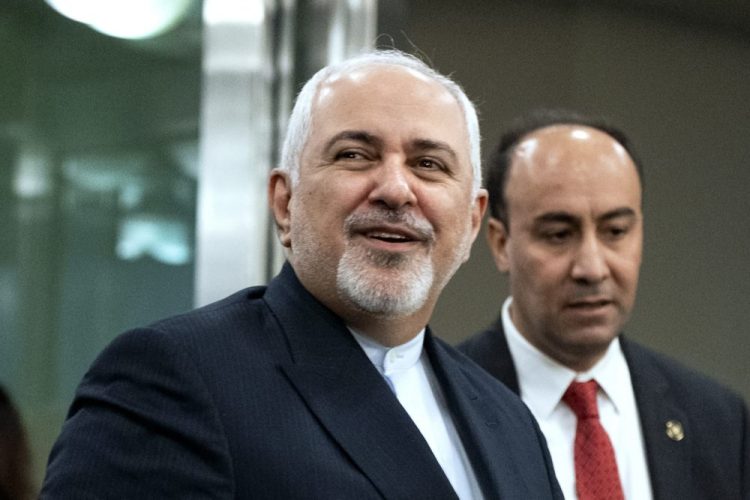 Iranian Foreign Minister Mohammad Javad Zarif, left, is shown last month at the United Nations General Assembly in New York. Microsoft has linked a hack targeting U.S. presidential campaigns to the Iranian government.