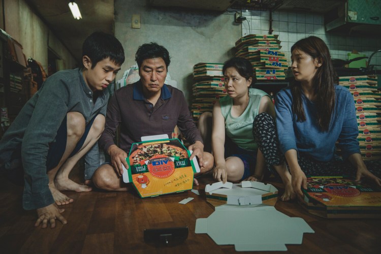 The Kim family, from left, Choi Woo Shik, Song Kang Ho, Chang Hye Jin and Park So Dam in "Parasite."