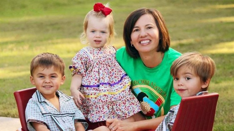 Nikki Baker-Limore with a child she adopted from a mother who was addicted to opioids, center, and her other two children in Tahlequah, Okla. As the opioid crisis progressed in the Cherokee Nation, more and more children were taken into tribal custody.