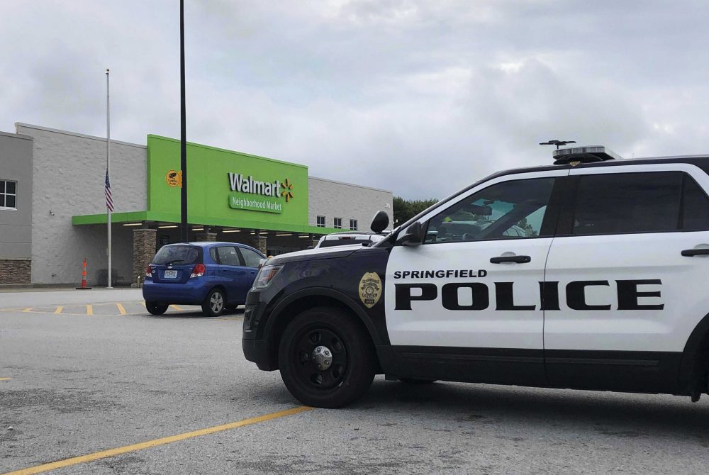 Springfield police respond to a Walmart in Springfield, Mo., Thursday afternoon, Aug. 8, 2019, after reports of a man with a weapon in the store. Police in Springfield, Missouri, say they have arrested an armed man who showed up the Walmart store wearing body armor, sending panicked shoppers fleeing the store. (Harrison Keegan/The Springfield News-Leader via AP)