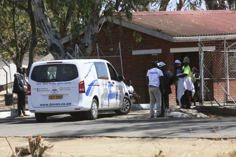 A van from a funeral parlor enters former Zimbabwe President Robert Mugabe's rural home in Zvimba on Saturday. 

