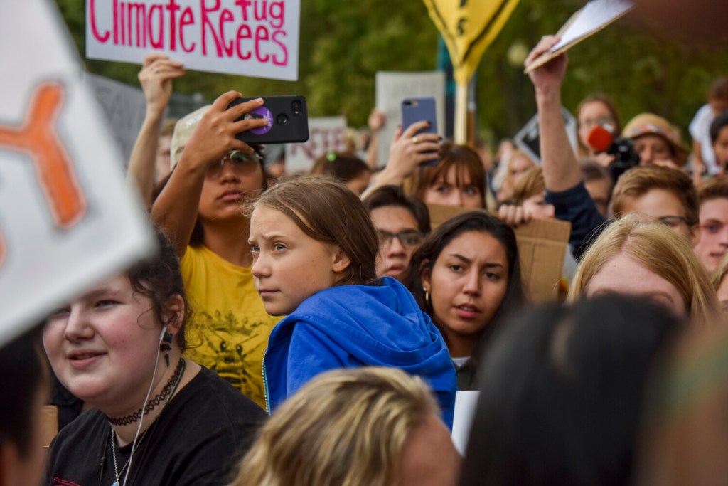 Greta Thunberg, the 16-year-old Swedish climate change activist who has inspired mass youth protests, joins other young climate activists for a climate strike demonstration outside the White House on Sept. 13, 2019, in Washington, D.C. MUST CREDIT: Washington Post photo by Jahi Chikwendiu