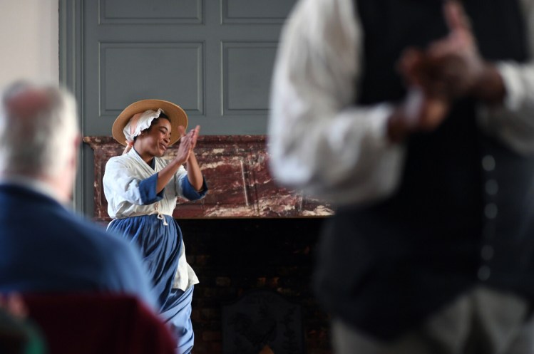 Katrinah Carol Lewis takes part in a performance of "Joy in the Morning" at Colonial Williamsburg in February 2019 in Williamsburg, Va. The program illustrates the life of slaves in colonial times. 