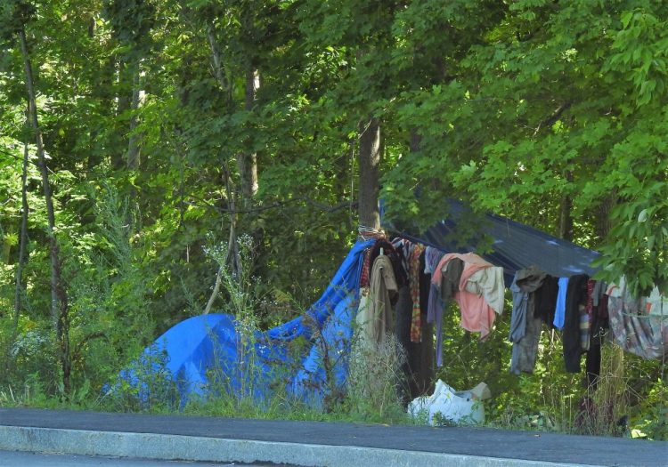 People have been dropping off items at the homeless encampment in Sanford’s mill district, which is causing problems, officials say.