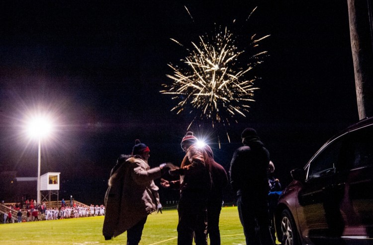 Fireworks light up the sky before a game between Wells and Maine Central Institute in Pittsfield last Friday night.