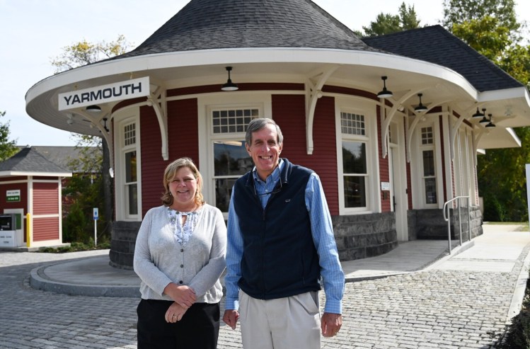  Maine Preservation's real estate manager Ali Barrionuevo and Executive Director Greg Paxton stand outside the Grand Trunk Railroad Depot in Yarmouth this month.