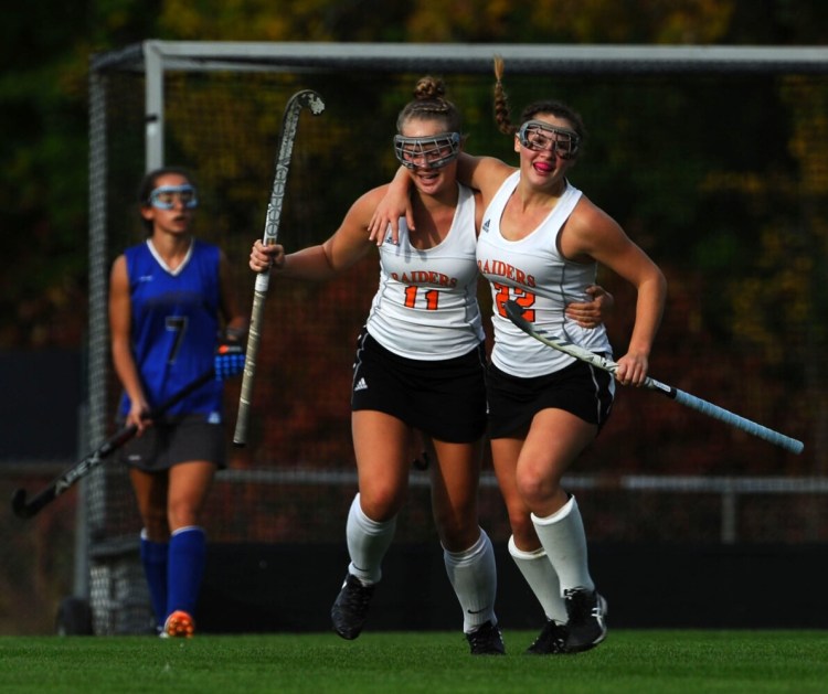 Winslow midfielder Bodhi Littlefield, right, celebrates her goal with teammate Silver Clukey during a game earlier this season in Winslow. The Black Raiders beat John Bapst in the Class B North quarterfinals on Tuesday.