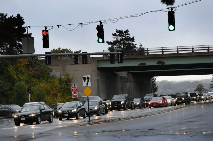 Traffic is backed up Friday morning at the intersection Franklin Street and Marginal Way. In a bid to ease congestion at the busy Interstate 295 interchange, the city is equipping traffic signals on Franklin Street with sensors that will assess traffic conditions and adjust the timing and coordination of the stoplights. 