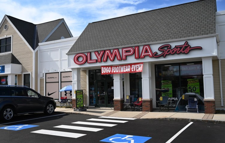 Olympia Sports in Falmouth displays sale signs in its windows in October 2019. 