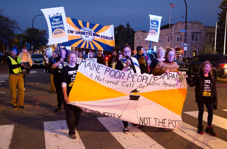 More than 300 people marched down Congress Street on Thursday night as part of the Poor People's Campaign, a national effort to focus attention on poverty, racism and ecological injustice.
