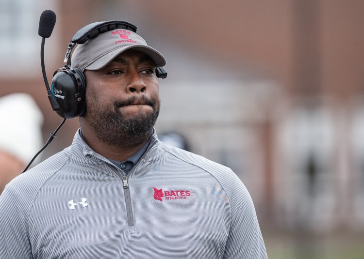 Bates head football coach Malik Hall looks at the scoreboard during a 2019 game. Hall, who is no longer with Bates, filed a civil rights lawsuit last week alleging racial discrimination by the school, among other charges.