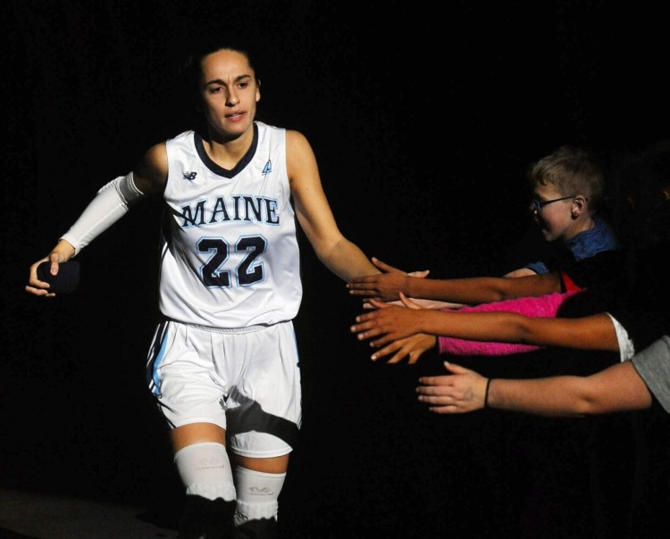 University of Maine's Blanca Millan is greeted by fans as she  enters the Cross Insurance Center in Bangor prior to a 2019 preseason game against Stonehill College. Millan scored a game-high 30 points in the Black Bears' season-opening win over Providence on Thursday.