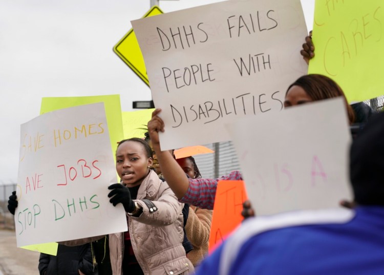 Deborah Bafongo, a house supervisor with Residential Care and Support Services, protests with other RCSS employees near the Department of Health and Human Services office in South Portland on Oct. 28. About 40 RCSS employees protested because the state canceled its contract with RCSS after a man with intellectual disabilities died in one of its homes in August.