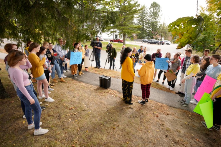 Cape Elizabeth High School senior Christena Gikas, center at left, speaks to students who walked out of school on Monday to protest the suspension of students following complaints of how the school handled recent sexual assault allegations. 