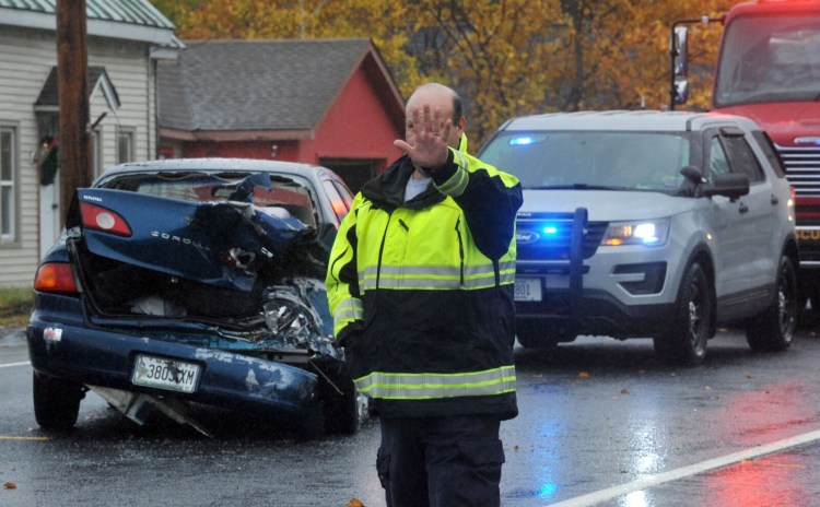 Firefighters work a multi-vehicle accident Wednesday outside the Hinckley General Store at 764 US Route 201 in Hinckley.