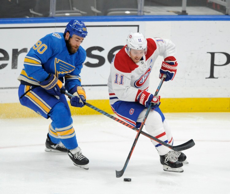 Montreal's Brendan Gallagher (11) battles for the puck with St. Louis' Ryan O'Reilly during the Canadiens' 5-2 win on Saturday in St. Louis.