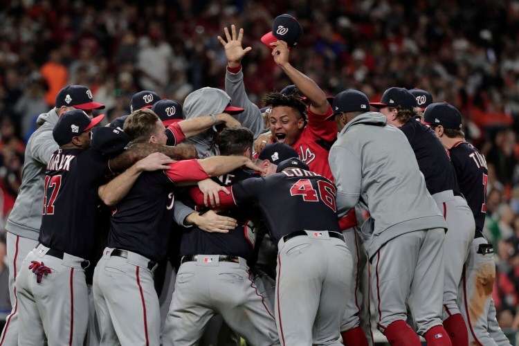 The Washington Nationals celebrate after Game 7 of the baseball World Series against the Houston Astros Wednesday.