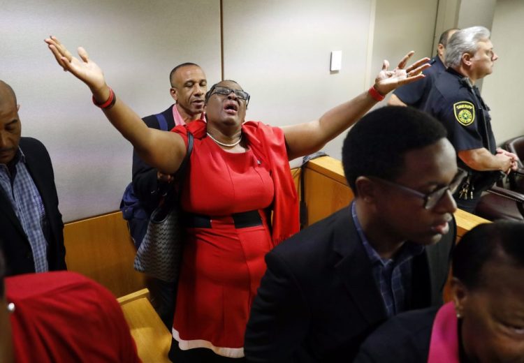 Botham Jean's mother, Allison Jean, rejoices in the courtroom Tuesday after fired Dallas police Officer Amber Guyger was found guilty of murder. Guyger shot and killed Botham Jean, an unarmed 26-year-old neighbor in his own apartment last year. She told police she thought his apartment was her own and that he was an intruder.
