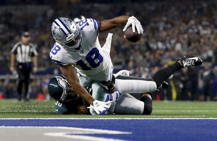 Dallas wide receiver Randall Cobb is stopped shy of the end zone after catching a pass Sunday night in Arlington.