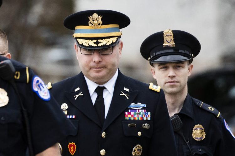The testimony of Army Lt. Col. Alexander Vindman, a military officer at the National Security Council, center, before House committees that are conducting the impeachment inquiry into President Trump, was released Friday. 