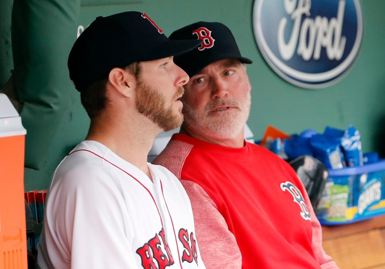 Dana LeVangie, right, talking with Chris Sale, was relieved as the Red Sox pitching coach on Tuesday. 