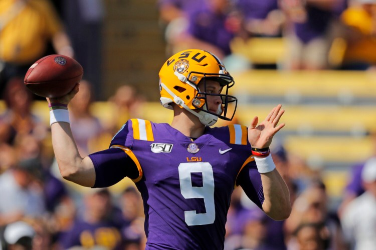 LSU quarterback Joe Burrow became the first quarterback to pass for more the 300 yards in four straight games and threw for five touchdowns to help the Tigers beat Utah State 42-6 on Saturday in Baton Rouge, La. 