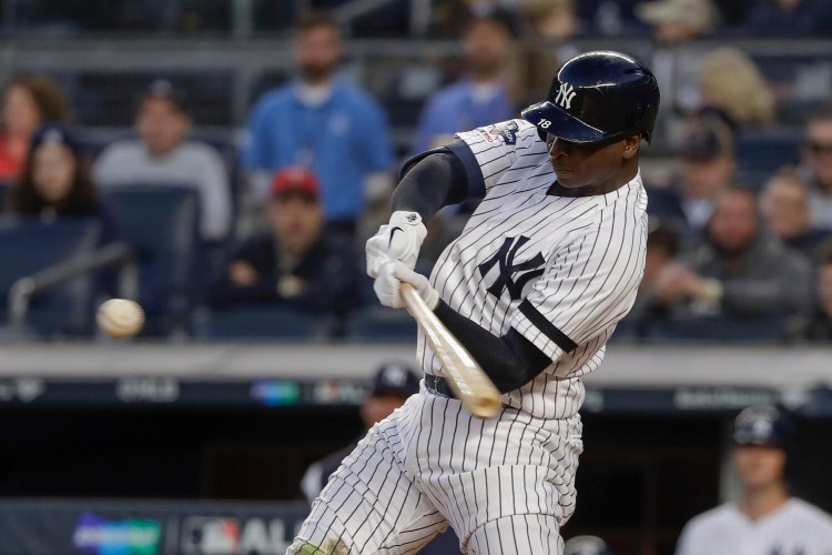 Didi Gregorius connects for a grand slam home run for New York against the Minnesota Twins during the third inning of Game 2 of an American League Division Series on Saturday. 