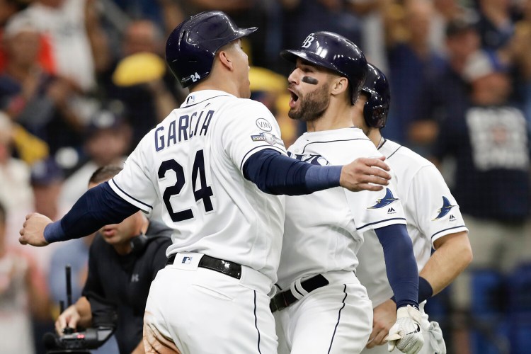 Tampa Bay's Kevin Kiermaier, right, celebrates his three-run home run in the second inning of the Rays' 10-2 win over the Houston Astros in Game 3 of their ALDS on Monday in St. Petersburg, Fla.