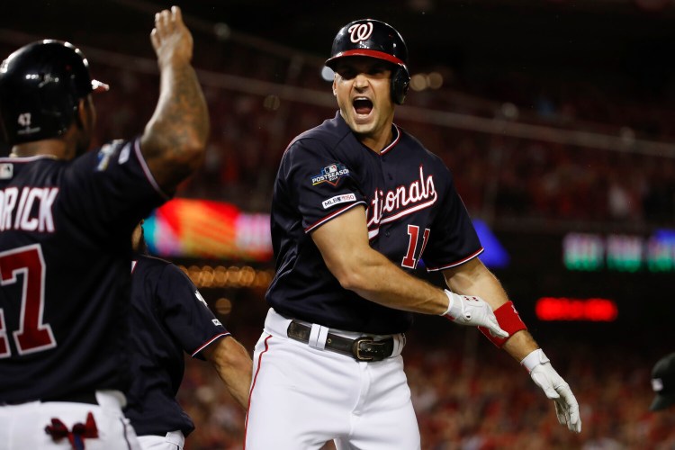 Ryan Zimmerman celebrates after hitting 
a three-run home run in Washington's 6-1 win over Los Angeles in Game 4 of their NLDS on Monday in Washington. 