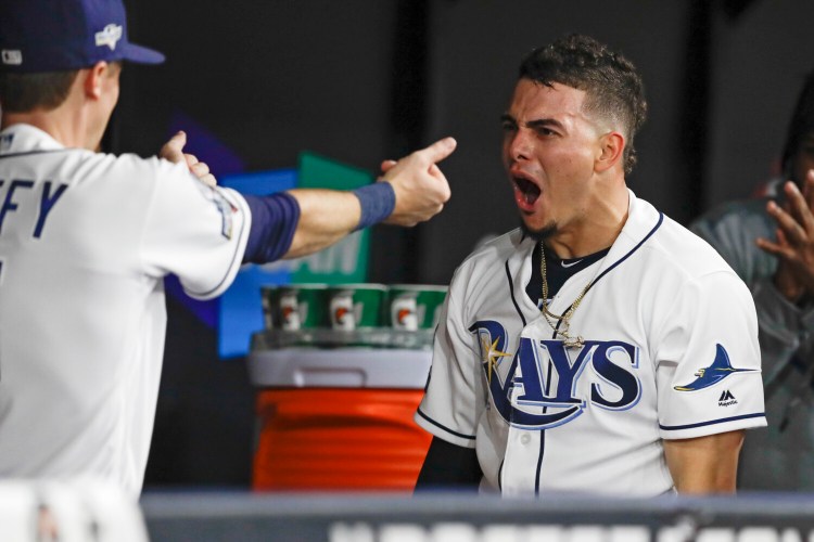 Tampa Bay's Willy Adames, right, celebrates his solo home run against the Houston Astros during the fourth inning of Game 4 Tuesday in St. Petersburg, Fla

