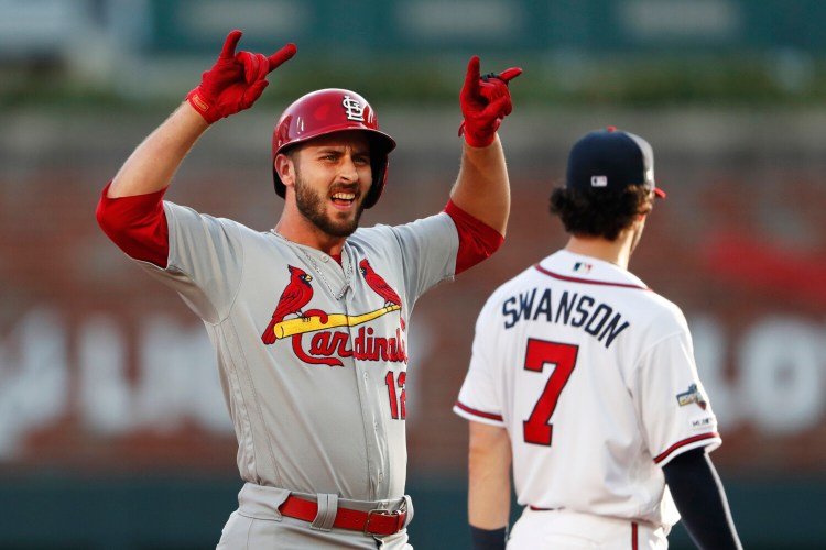 Paul DeJong celebrates after hitting a double to score a run in the second inning of Wednesday's win over Atlanta in Game 5 of the NLDS in Atlanta.