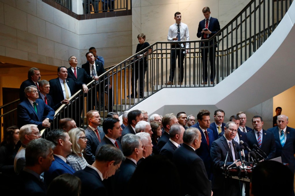 House Republicans gather for a news conference after Deputy Assistant Secretary of Defense Laura Cooper arrived for a closed door meeting to testify as part of the House impeachment inquiry into President Donald Trump, Wednesday, Oct. 23, 2019, on Capitol Hill in Washington. (AP Photo/Patrick Semansky)
