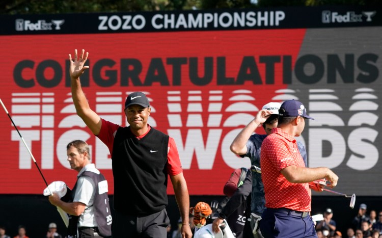 Tiger Woods celebrates after winning the Zozo Championship PGA Tour on Monday at the Accordia Golf Narashino country club in Inzai, east of Tokyo, Japan. It was Woods' record-tying 82nd PGA Tour victory.
