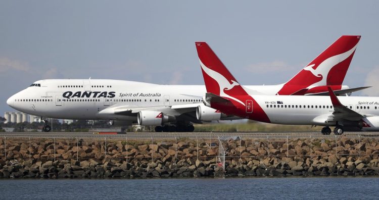 Two Qantas planes taxi on the runway at Sydney Airport in Australia in 2015. Australia's Qantas completed the first nonstop commercial flight from New York to Sydney on Sunday.
