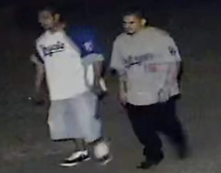 This frame grab from surveillance video provided by the Kansas City, Kan. Police Department shows two suspects authorities are looking for in connection with a fatal shooting at a bar early Sunday in Kansas City. 