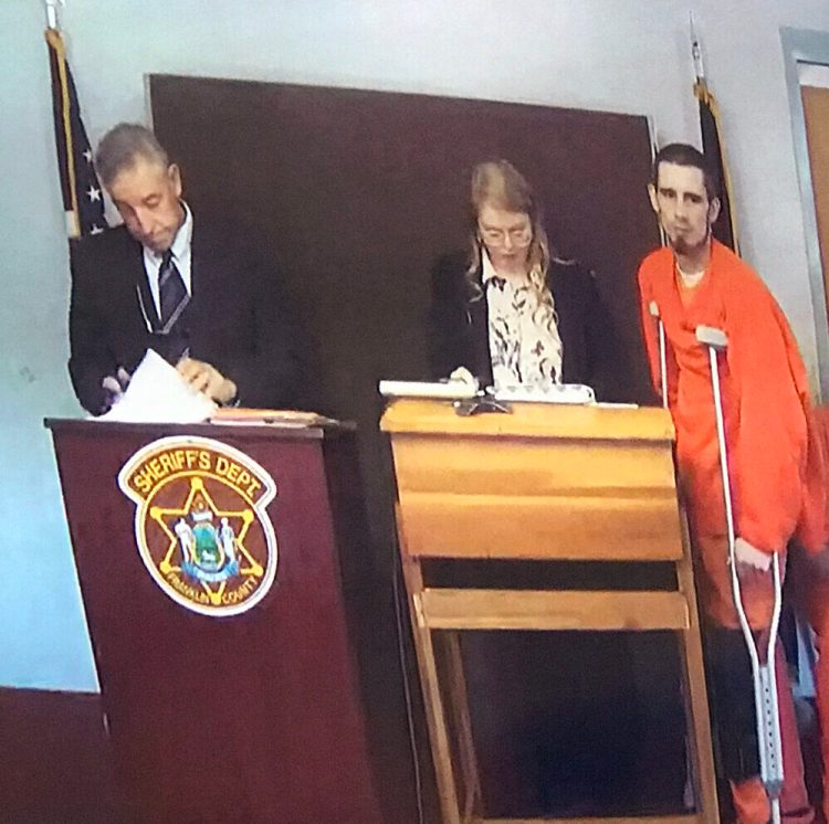 Deputy District Attorney James Andrews, left, defense attorney Ashley Perry and defendant Isaac E. Moody of Kingfield appear Monday in 8th District Court in Lewiston via videoconference from the Franklin County Detention Center in Farmington. 