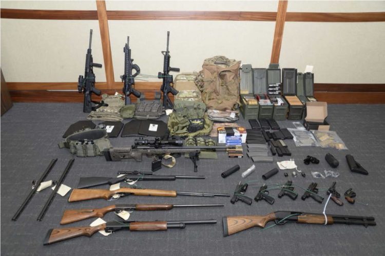 A photo of firearms and ammunition that was in the motion for detention pending trial in the case against Christopher  Hasson. Prosecutors say that Hasson, a Coast Guard lieutenant is a "domestic terrorist" who wrote about biological attacks and had a hit list that included prominent Democrats and media figures. 