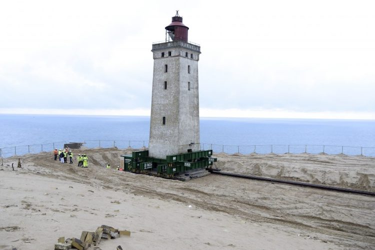 The Rubjerg Knude Lighthouse was put on wheels and rails in order to be moved 263 feet away from the North Sea in Jutland, Denmark, on Tuesday to protect it from coastal erosion. 