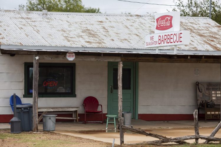 This Oct. 11, 2019 photo shows The Gas Station in Bastrop, Texas,  famous for its appearance in the cult horror classic, "The Texas Chain Saw Massacre." Today it also serves barbecue and sells horror-related merchandise. 