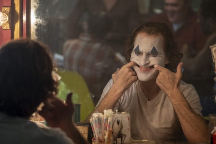 This image released by Warner Bros. Pictures shows Joaquin Phoenix in a scene from "Joker," in theaters on Oct. 4.  