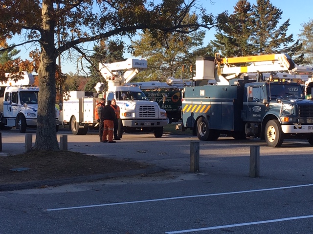 CMP and contractor trucks sit gathered at an impromptu staging area in front of Cape Elizabeth High School on Saturday morning. 