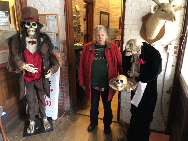 Deborah Staber, director and curator of LC Bates Museum with creepy creatures who greet visitors just inside the door during tour of the Halloween display in Hinkley October 27.