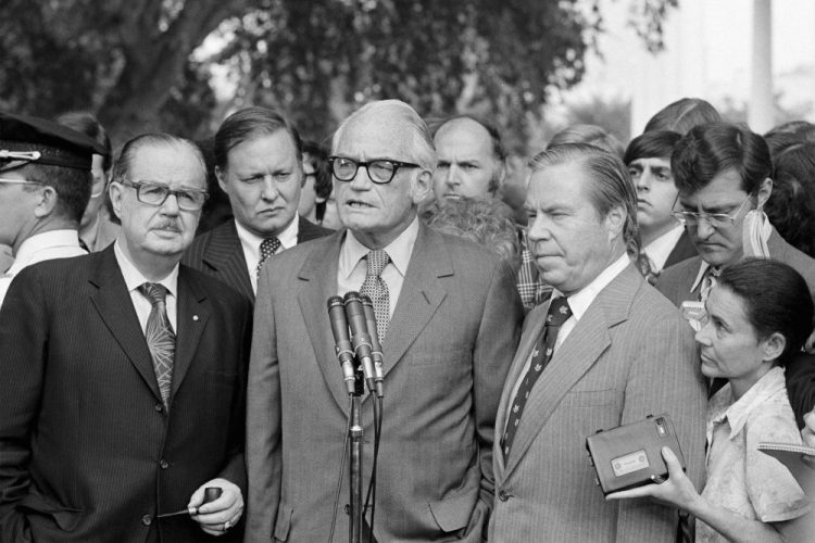 Sen. Barry Goldwater, R-Ariz., center, speaks to reporters after meeting with President Richard Nixon at the White House to discuss Nixon's decision on resigning. Flanked by Senate Republican Leader Hugh Scott of Pennsylvania, left and House Republican Leader John Rhodes of Arizona, right, Goldwater said Nixon has made "no decision" on whether to resign. The three top Republican leaders in Congress paid a solemn visit to Nixon, bearing the message that he faced near-certain impeachment due to eroding support in his own party on Capitol Hill. Nixon, who’d been entangled in the Watergate scandal for two years, announced his resignation the next day. 