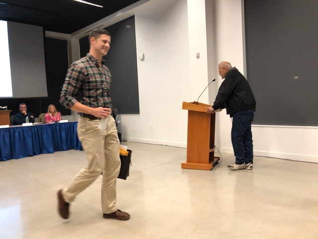 Waterville Mayor Nick Isgro leaves the council meeting early on Tuesday night. Later in the week he posted a letter online claiming councilors conspired with a resident who planned to attack him at Tuesday's meeting. 