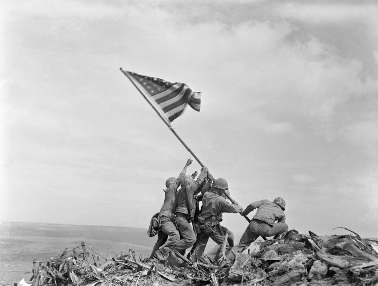 The Marine Corps has corrected the identity of another of the men who were photographed raising the American flag at Iwo Jima during World War II.  