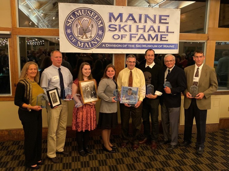 Maine's 2019 Maine Ski Hall of Fame inductees were honored Oct. 19 at Sugarloaf Mountain. From left are Leigh Breidenbach, Brent Jepsen standing in for Henry Anderson, Lizzie Chenard for Billy Chenard, Lindsay Ball, Jeff Schipper for Paul Schipper, Seth Wescott, Don Fowler and Bob Zinck. 
